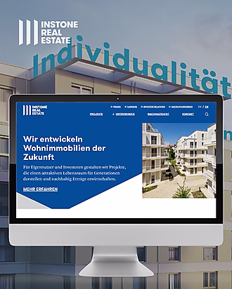 Monitor mit geöffneter Webseite von Instone Real Estate, die moderne Wohnimmobilienprojekte für Investoren und Eigennutzer präsentiert.