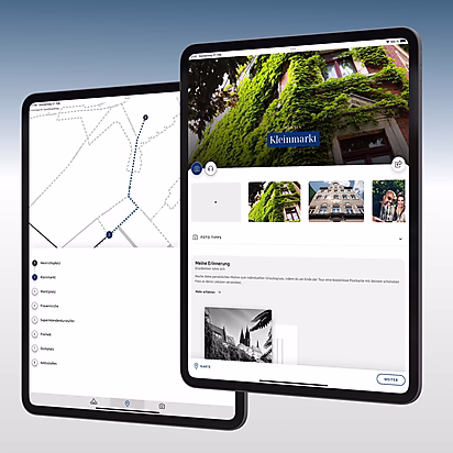 Zwei Tablets zeigen eine Karte mit dem Kleinmarkt und Informationen zu Sehenswürdigkeiten und Fototipps für Besucher.